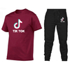 Camiseta 2021 Tendencia Personaje Cuello redondo Camiseta de manga corta + Pantalones de jogging Traje casual
